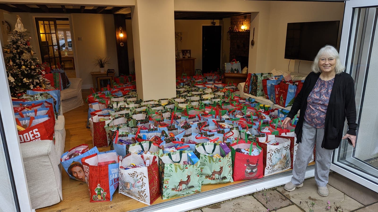 Norma Wilson in front of her home filled with hampers