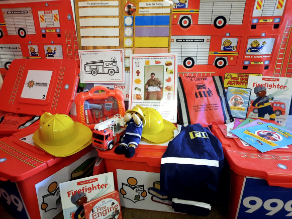 The contents of the WFRS Education Boxes - dress up costumes, books and activities